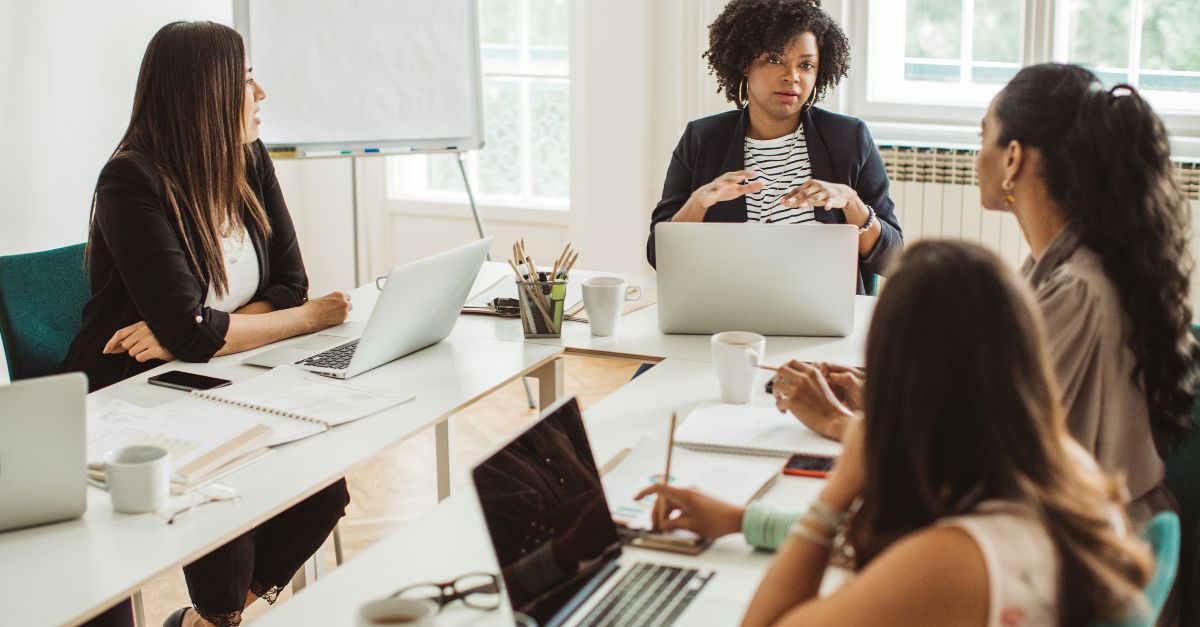 A group of colleagues working at a table.